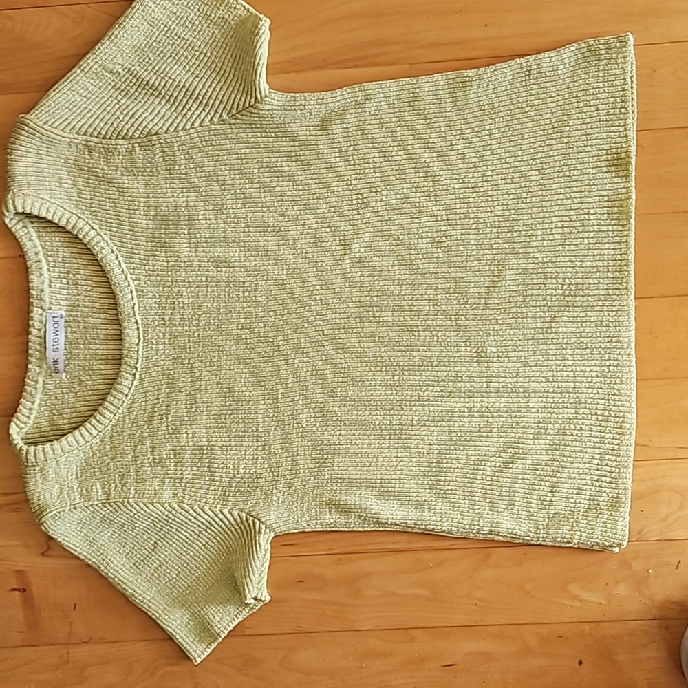 Erik Stewart light green shiny top.